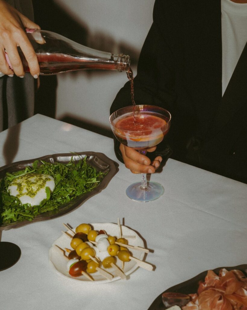 Drink served at the table with a burrata salad and olives, Sharing Nights at Les Clarisses